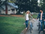 Dallas couple walking their bikes barefoot