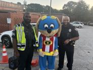 Sergeant White and Officer Baker with the School Safety Mascot