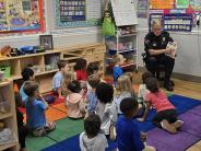 Lieutenant Weaver Reading to School Children 